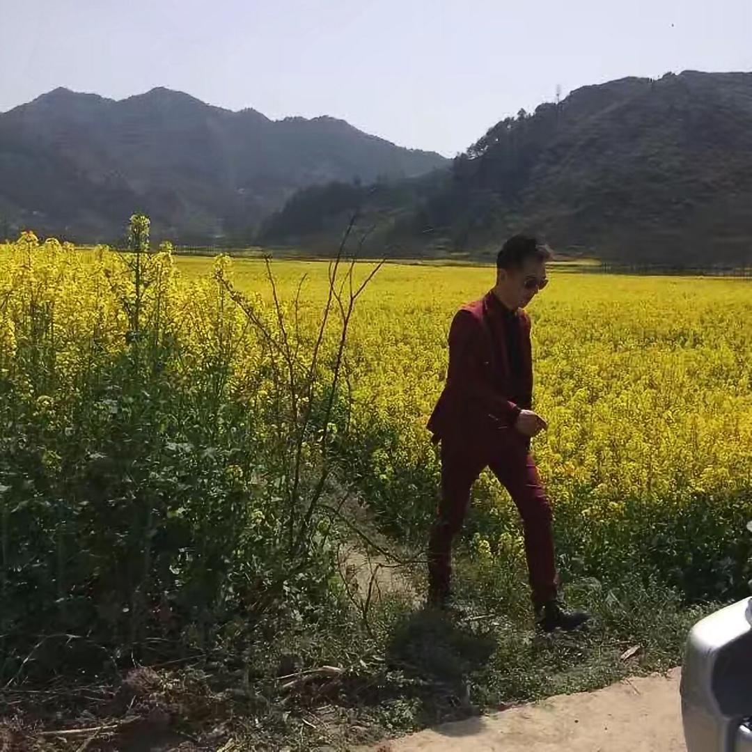 担当