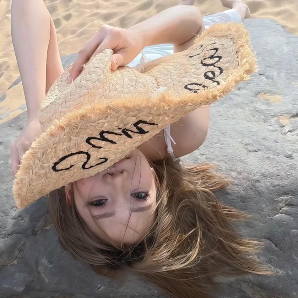 T.