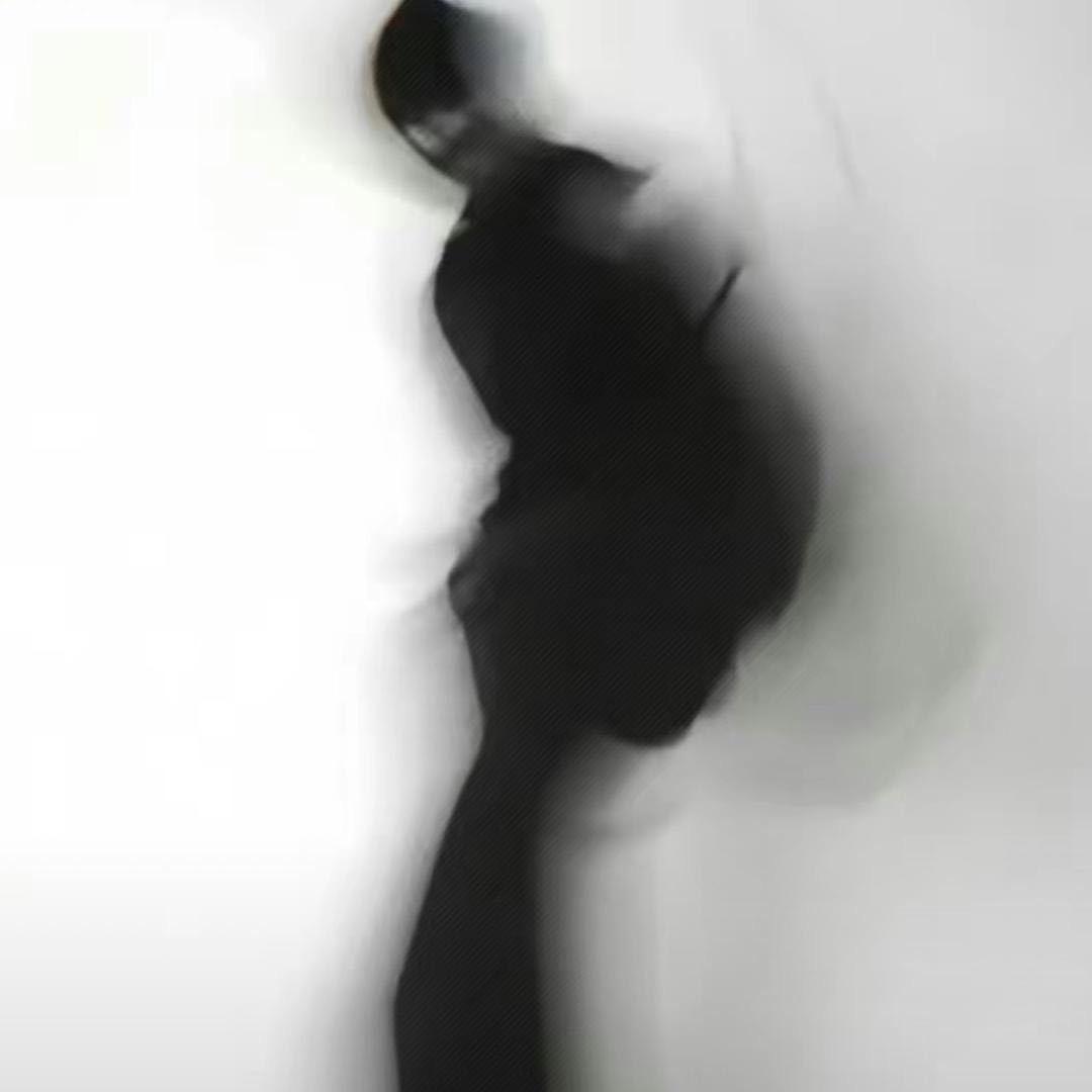 T.