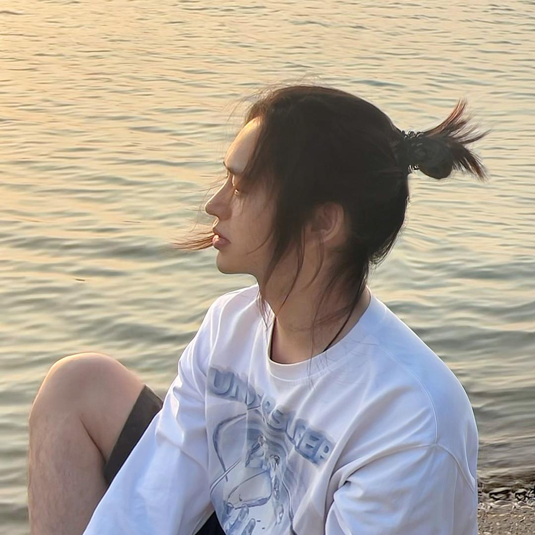 谭一.