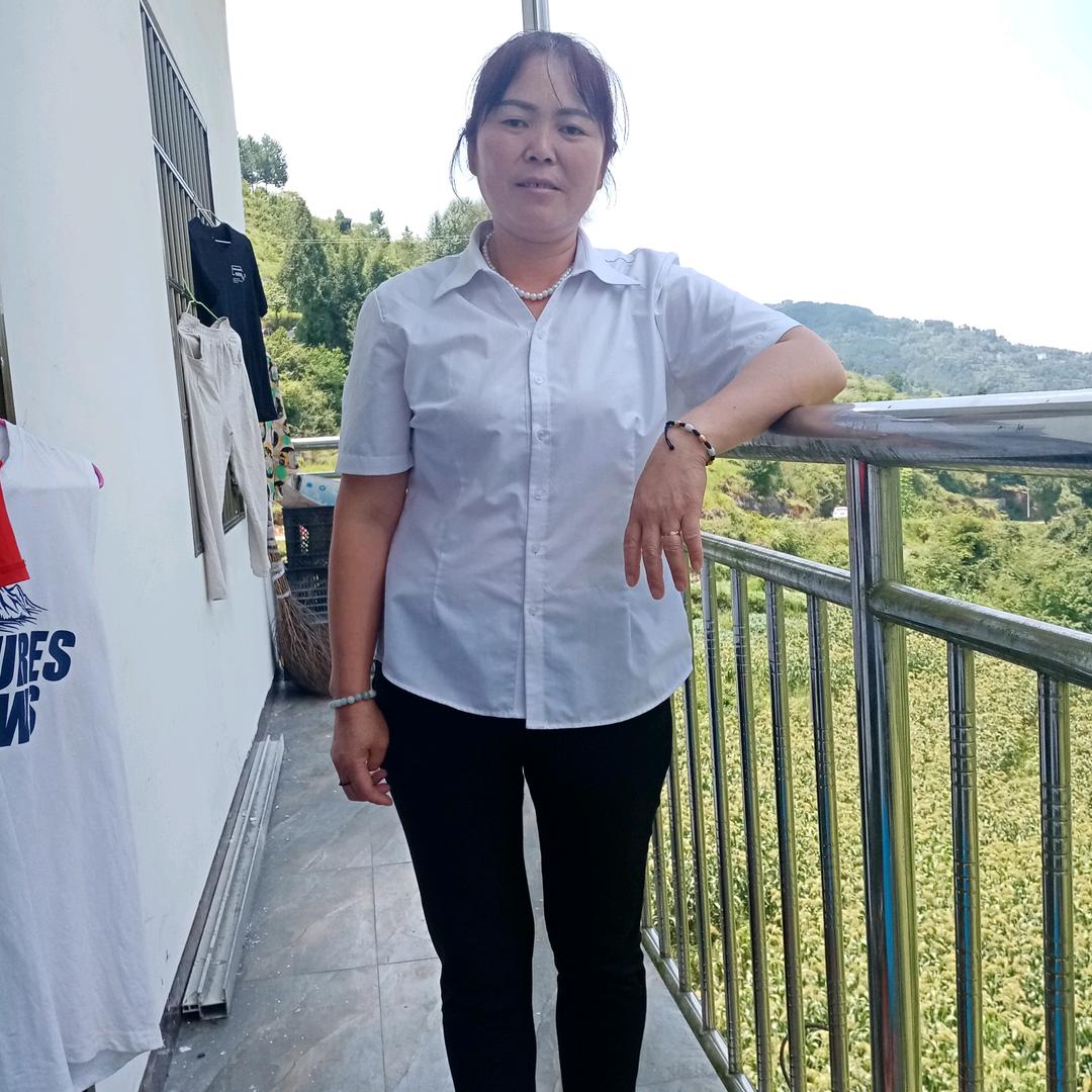 谢志美。