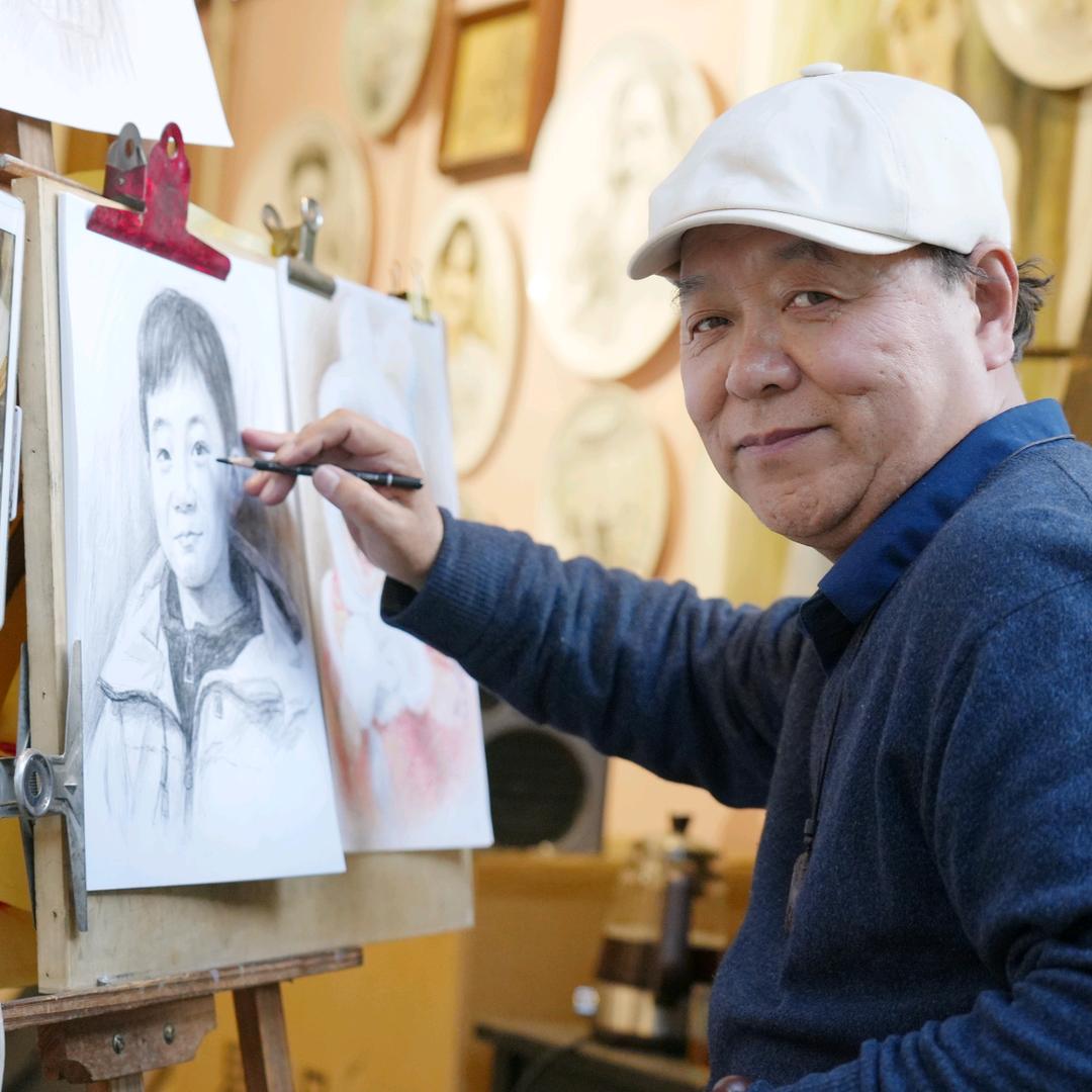 陕西咸阳袁家村画肖像的田林