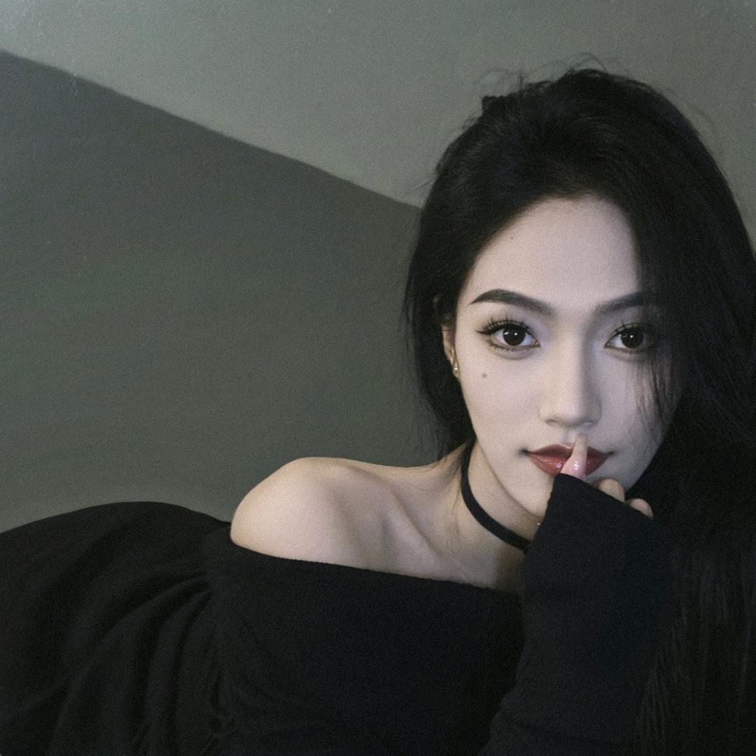 T.