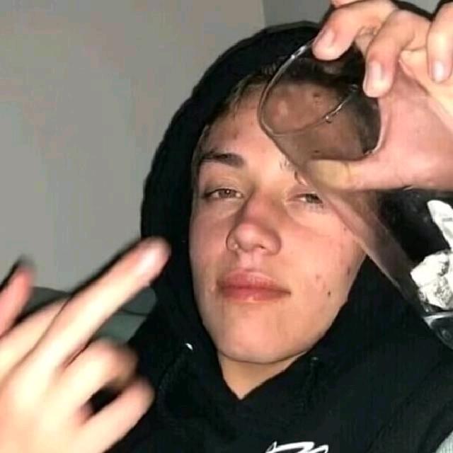 T.