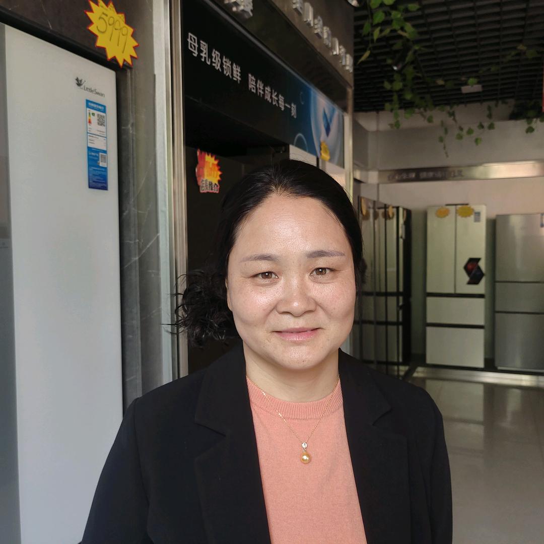 古寨卖家电的徐大姐